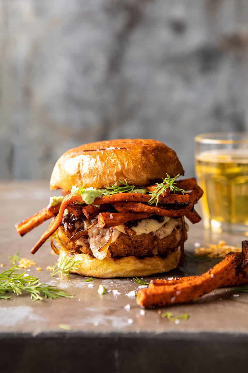 Crispy-Quinoa-Burgers-Topped-with-Sweet-Potato-Fries-and-Beer-Caramelized-Onions-1-1024x1536